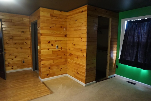 1758 Manor Rd, Au Gres, MI 48703 - spare room with visible vents, baseboards, and wood walls