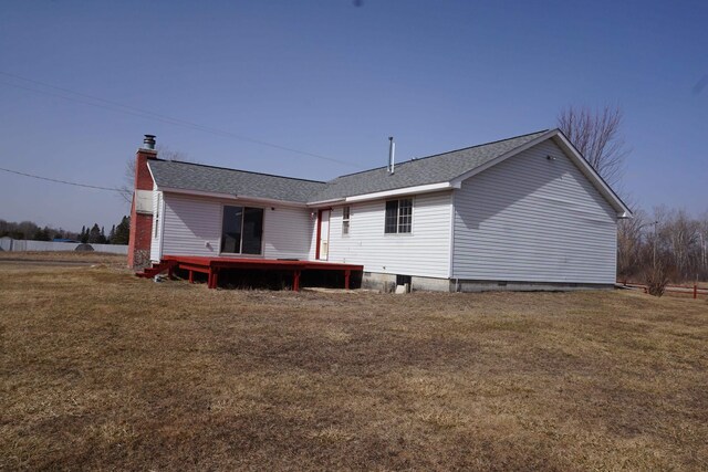 1758 Manor Rd, Au Gres, MI 48703 - rear view of property with a deck, a lawn, and roof with shingles