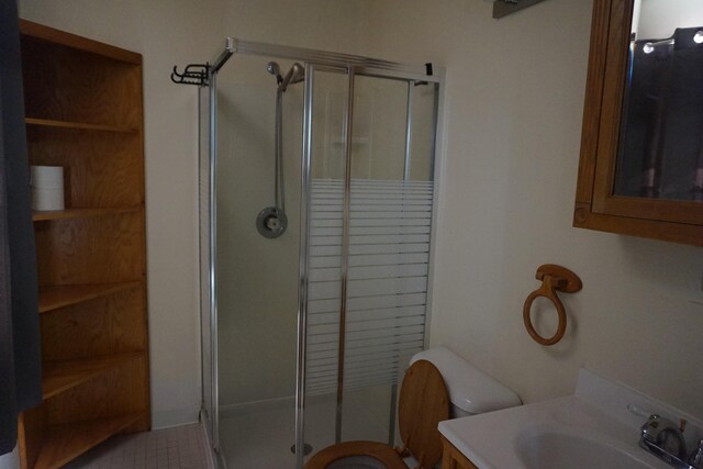 1758 Manor Rd, Au Gres, MI 48703 - bathroom with a shower stall, vanity, and toilet