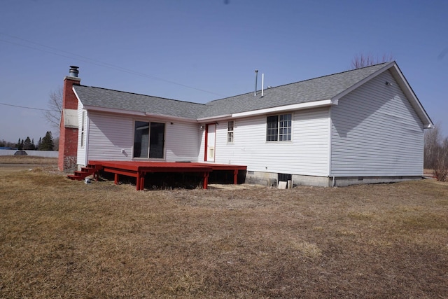 1758 Manor Rd, Au Gres, MI 48703 - rear view of house with a yard, a deck, a chimney, and roof with shingles