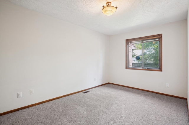131 E Jolly Rd Unit E6, Lansing, MI 48910 - unfurnished room featuring carpet floors, baseboards, and a textured ceiling