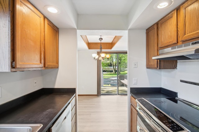 131 E Jolly Rd Unit E6, Lansing, MI 48910 - kitchen featuring a raised ceiling, range with electric cooktop, under cabinet range hood, dark countertops, and white dishwasher