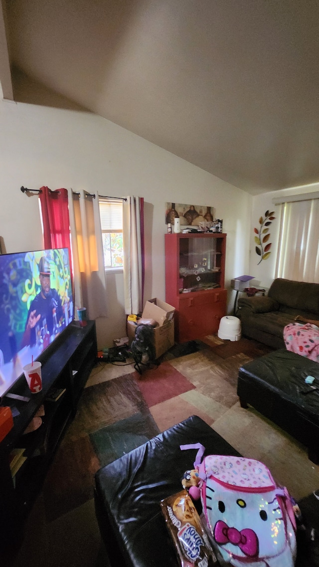 living area featuring lofted ceiling