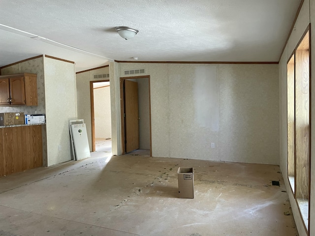 3947 W Jefferson Ave, Trenton, MI 48183 - interior space featuring visible vents, a textured ceiling, and crown molding