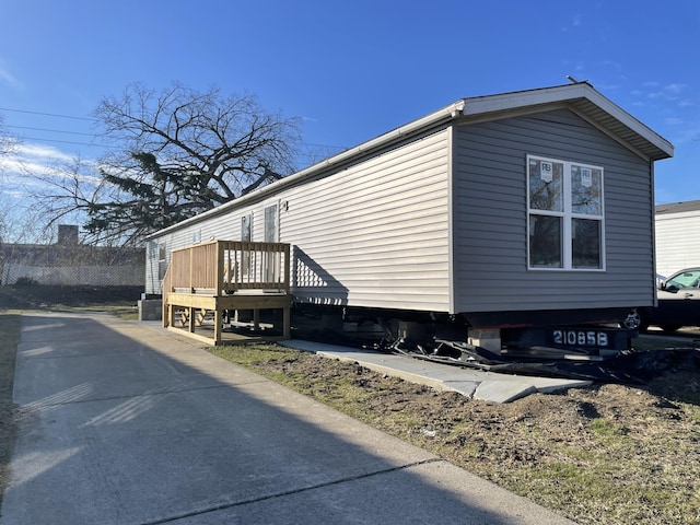 3936 W Jefferson Ave, Trenton, MI 48183 - view of side of property with a wooden deck