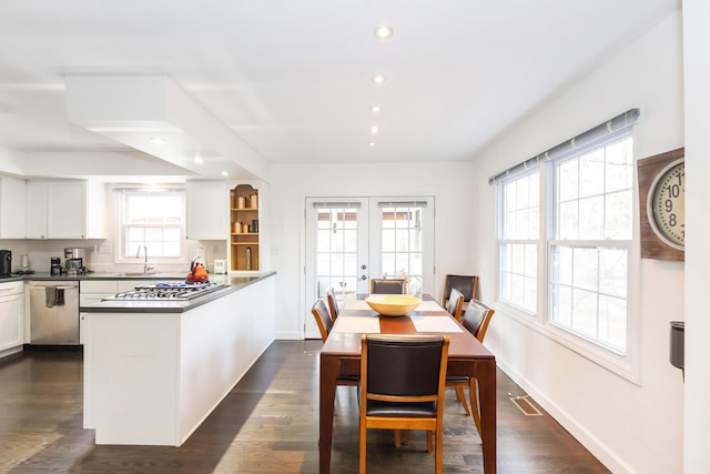 9696 Union Pier Rd, Union Pier, MI 49129 - kitchen with french doors, appliances with stainless steel finishes, a peninsula, and white cabinetry