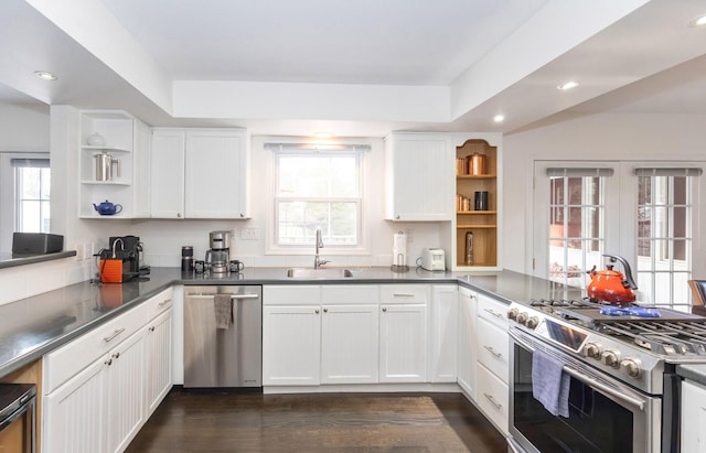 9696 Union Pier Rd, Union Pier, MI 49129 - kitchen with a sink, open shelves, white cabinetry, and stainless steel appliances