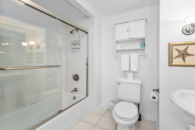 9696 Union Pier Rd, Union Pier, MI 49129 - full bathroom featuring toilet, tile patterned floors, shower / bath combination with glass door, a sink, and baseboards