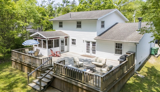 9696 Union Pier Rd, Union Pier, MI 49129 - rear view of house with a shingled roof, a sunroom, a wooden deck, an outdoor living space, and a lawn