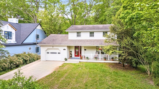 9696 Union Pier Rd, Union Pier, MI 49129 - view of front of house featuring covered porch, a garage, concrete driveway, a front yard, and a shingled roof