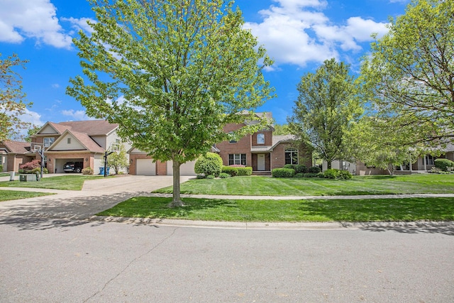 6317 Wilson Rd, Ann Arbor, MI 48108 - view of front of property featuring brick siding, concrete driveway, an attached garage, and a front yard