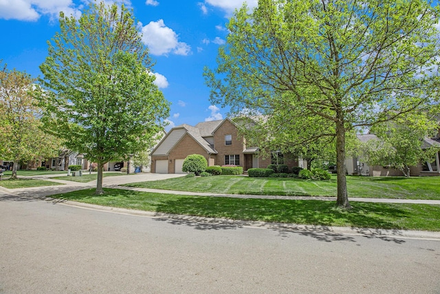 6317 Wilson Rd, Ann Arbor, MI 48108 - view of property hidden behind natural elements with brick siding, an attached garage, concrete driveway, and a front lawn