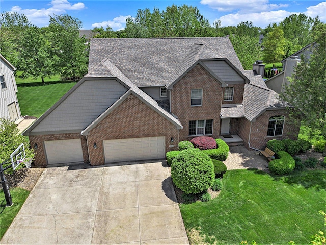 6317 Wilson Rd, Ann Arbor, MI 48108 - traditional-style house with brick siding, a garage, a front lawn, a shingled roof, and concrete driveway