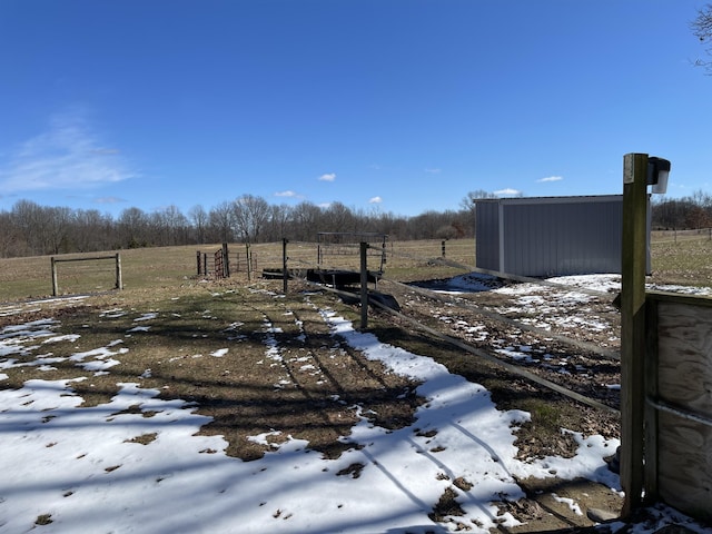70255 51st St, Lawrence, MI 49064 - snowy yard with fence and a rural view