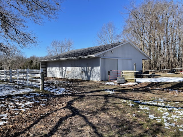 70255 51st St, Lawrence, MI 49064 - snow covered structure with a pole building, fence, and an outbuilding