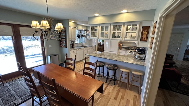 70255 51st St, Lawrence, MI 49064 - dining room with recessed lighting, a textured ceiling, light wood finished floors, and a notable chandelier
