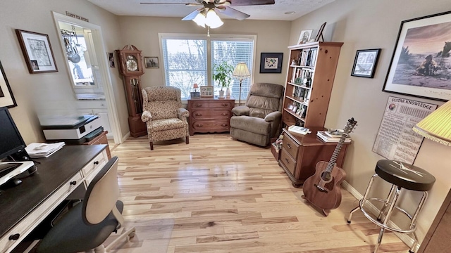70255 51st St, Lawrence, MI 49064 - sitting room featuring ceiling fan, baseboards, and light wood-style floors