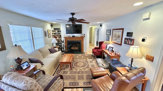 70255 51st St, Lawrence, MI 49064 - living area with a ceiling fan, a glass covered fireplace, wood finished floors, and recessed lighting