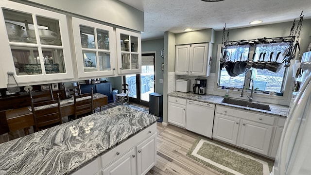70255 51st St, Lawrence, MI 49064 - kitchen with light stone countertops, a sink, light wood-style floors, white appliances, and white cabinetry