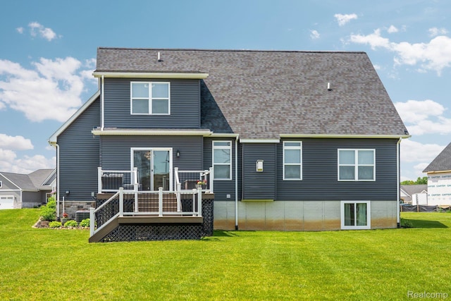 9931 Loretta Ln, South Lyon, MI 48178 - rear view of house featuring a lawn, a deck, and roof with shingles