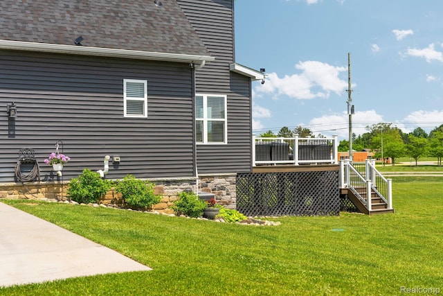 9931 Loretta Ln, South Lyon, MI 48178 - view of side of property with a wooden deck, a lawn, stairway, and roof with shingles