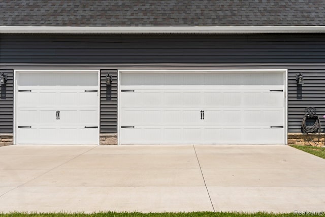 9931 Loretta Ln, South Lyon, MI 48178 - garage featuring driveway
