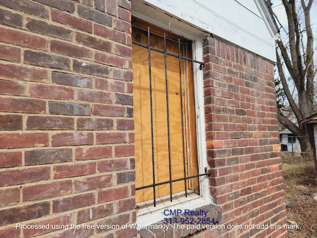15876 Burt Rd, Detroit, MI 48223 - doorway to property with brick siding