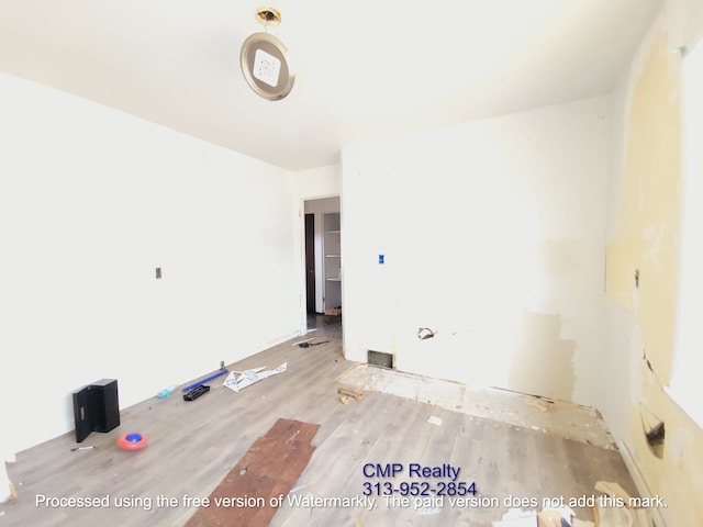 15876 Burt Rd, Detroit, MI 48223 - spare room featuring wood finished floors