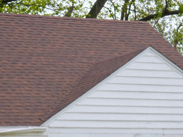 15876 Burt Rd, Detroit, MI 48223 - exterior view of roof with shingles and a standing seam roof