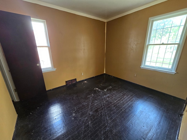 15876 Burt Rd, Detroit, MI 48223 - empty room featuring ornamental molding, baseboards, and dark wood-style flooring