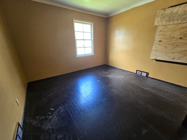 15876 Burt Rd, Detroit, MI 48223 - unfurnished room featuring wood finished floors and crown molding