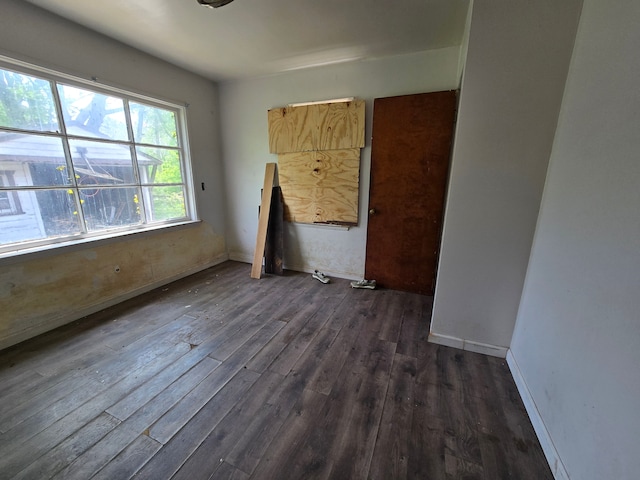 15876 Burt Rd, Detroit, MI 48223 - unfurnished room featuring dark wood-style flooring and baseboards