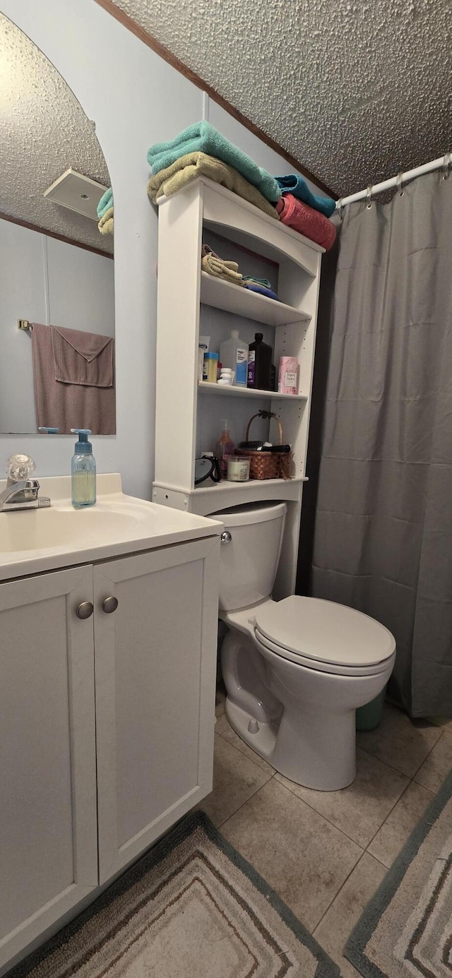 3867 Joseph St, Wellston, MI 49689 - bathroom featuring toilet, vanity, tile patterned floors, curtained shower, and a textured ceiling