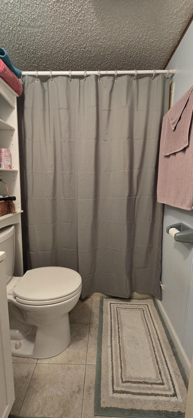 3867 Joseph St, Wellston, MI 49689 - bathroom featuring toilet, a shower with shower curtain, and a textured ceiling