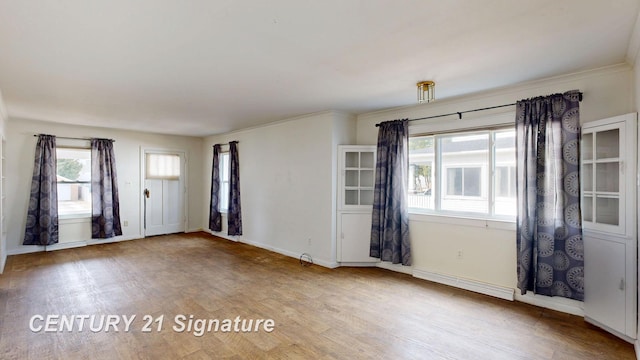 308 S Elm St, Saginaw, MI 48602 - empty room featuring baseboards and wood finished floors