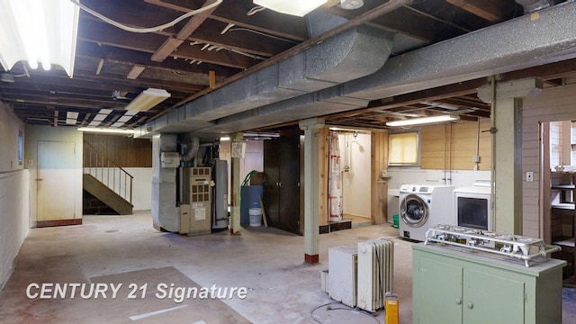 308 S Elm St, Saginaw, MI 48602 - unfinished below grade area with washing machine and clothes dryer, stairway, gas water heater, and heating unit