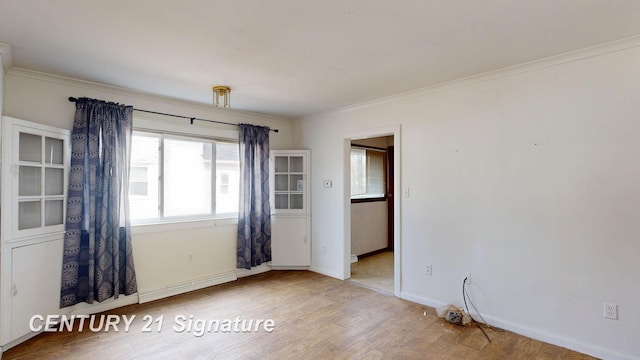 308 S Elm St, Saginaw, MI 48602 - unfurnished room featuring crown molding, baseboards, and wood finished floors
