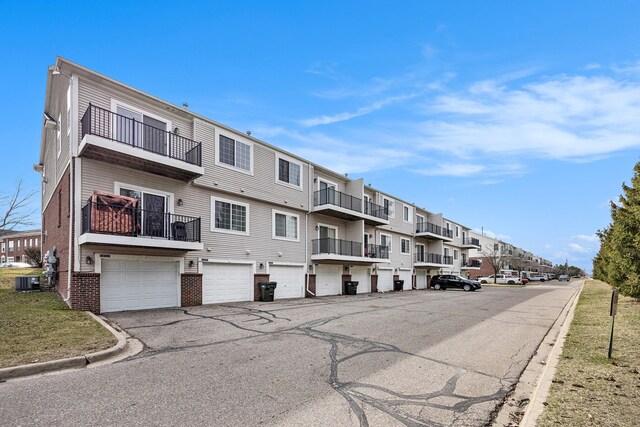 view of road featuring a residential view and curbs