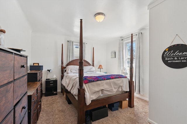 carpeted bedroom featuring baseboards