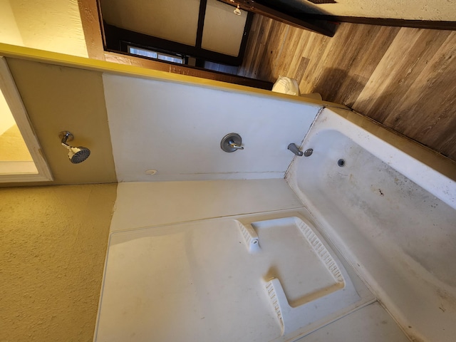 3491 Garland St, Detroit, MI 48214 - bathroom featuring wooden walls and a tub to relax in