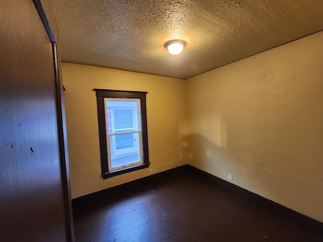 3491 Garland St, Detroit, MI 48214 - unfurnished room with baseboards and a textured ceiling