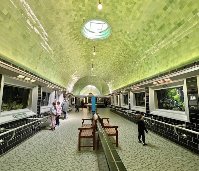 interior space with brick ceiling and vaulted ceiling