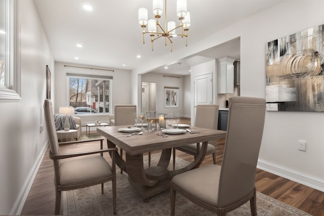 dining space featuring recessed lighting, baseboards, a chandelier, and wood finished floors