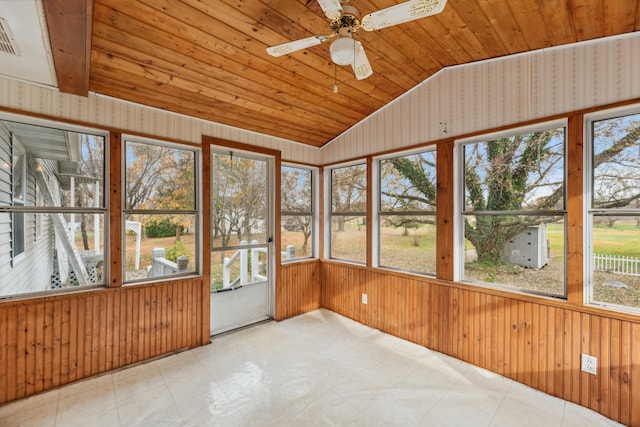 unfurnished sunroom featuring ceiling fan