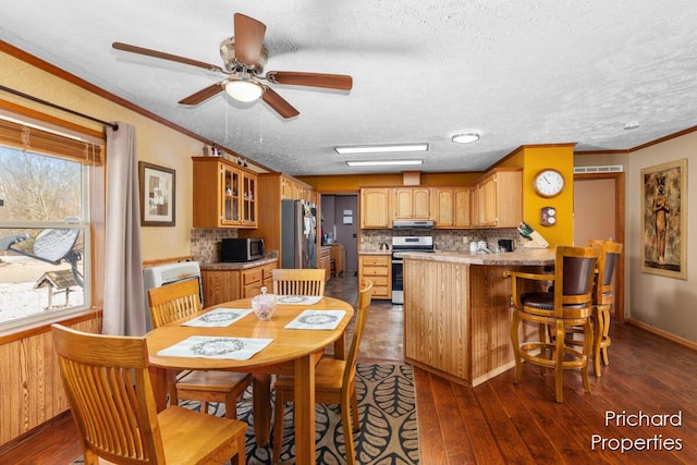 dining room with crown molding, a ceiling fan, dark wood-type flooring, and a textured ceiling