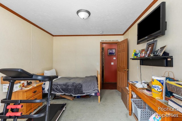 bedroom featuring visible vents, carpet, crown molding, and a textured ceiling