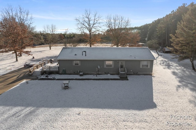 rear view of house featuring crawl space and a wooden deck