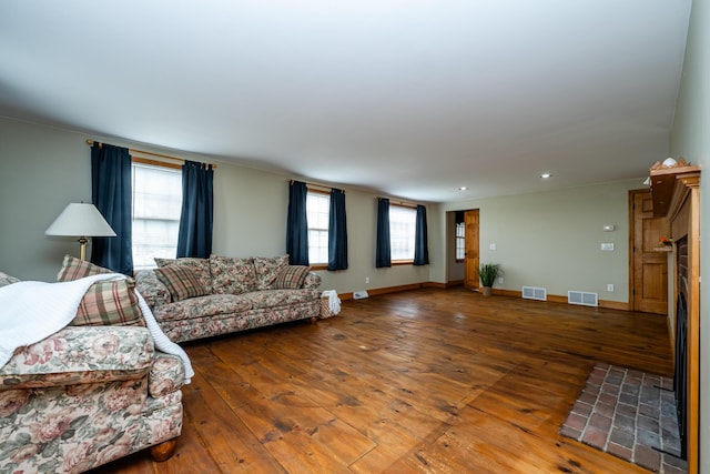 9654 Date Rd, Baroda, MI 49101 - living area featuring visible vents, wood-type flooring, and baseboards