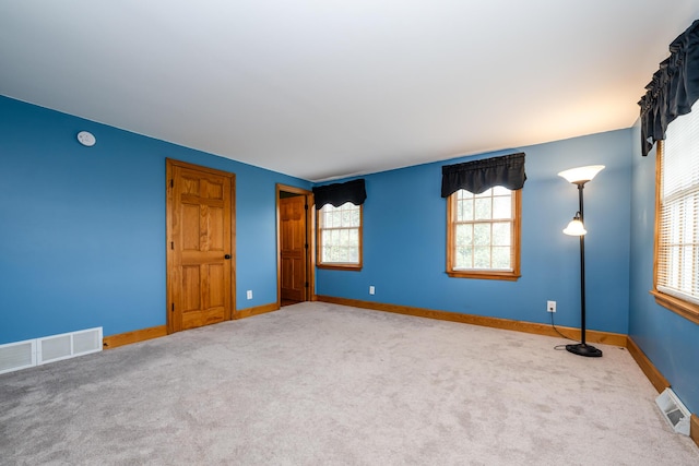 9654 Date Rd, Baroda, MI 49101 - unfurnished room with carpet, visible vents, and baseboards