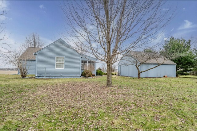 9654 Date Rd, Baroda, MI 49101 - view of home's exterior featuring a lawn, an outdoor structure, and a pole building